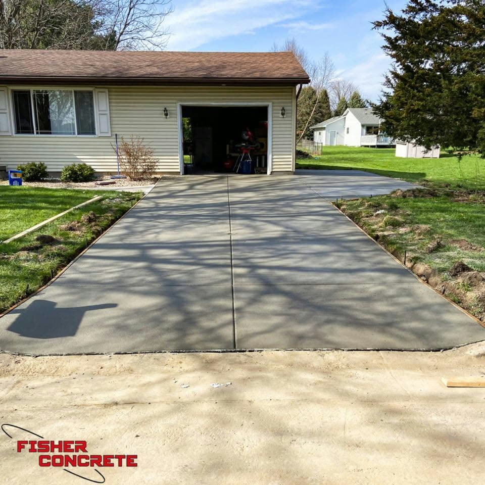 Full driveway replacement leading to an attached garage